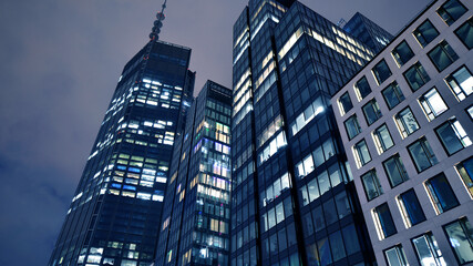 Office building at night, building facade with glass and lights. View with illuminated modern skyscraper. - 757818963
