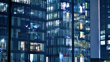 Office building at night, building facade with glass and lights. View with illuminated modern skyscraper. - 757820586