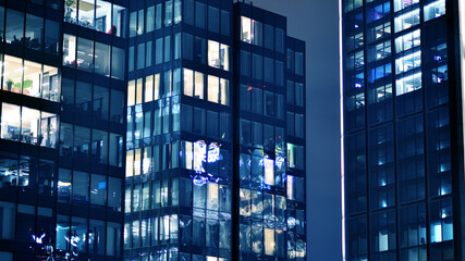 Office building at night, building facade with glass and lights. View with illuminated modern skyscraper. - 757820717