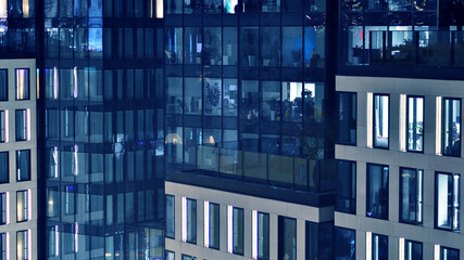 Office building at night, building facade with glass and lights. View with illuminated modern skyscraper. - 757820739