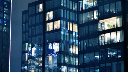 Office building at night, building facade with glass and lights. View with illuminated modern skyscraper. - 757820751