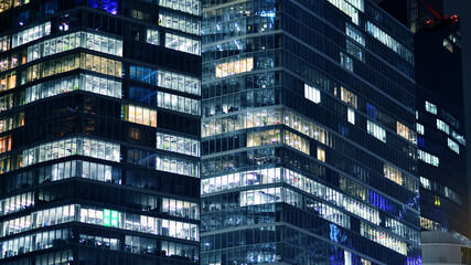 Office building at night, building facade with glass and lights. View with illuminated modern skyscraper. - 757820956