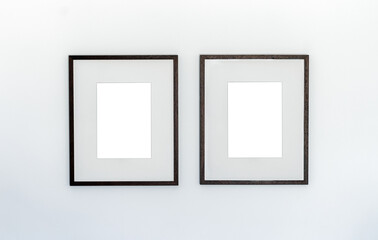 Two wooden frame on white wall, empty frame poster mockup, Clean modern minimal frame  - 757820979