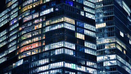 Office building at night, building facade with glass and lights. View with illuminated modern skyscraper. - 757821122