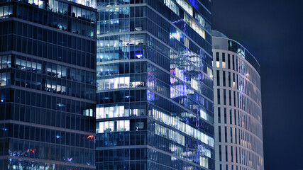 Office building at night, building facade with glass and lights. View with illuminated modern skyscraper. - 757821172