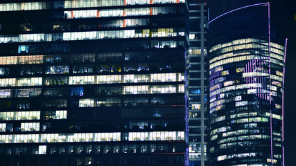 Office building at night, building facade with glass and lights. View with illuminated modern skyscraper. - 757821302