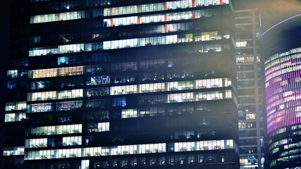 Office building at night, building facade with glass and lights. View with illuminated modern skyscraper. - 757821314