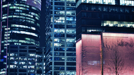 Office building at night, building facade with glass and lights. View with illuminated modern skyscraper. - 757821354