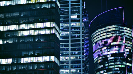 Office building at night, building facade with glass and lights. View with illuminated modern skyscraper. - 757821378