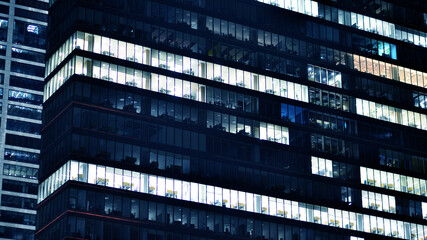 Office building at night, building facade with glass and lights. View with illuminated modern skyscraper. - 757821524