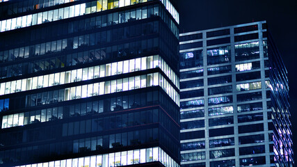 Office building at night, building facade with glass and lights. View with illuminated modern skyscraper. - 757821545