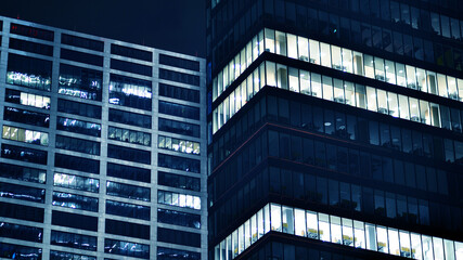 Office building at night, building facade with glass and lights. View with illuminated modern skyscraper. - 757821551