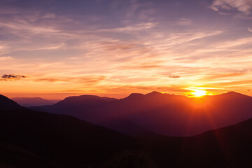 Fototapeta na wymiar Sunset at mountain background
