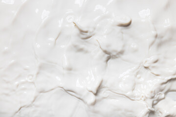 Fototapeta na wymiar real photo of milk ripple, drop of splash water waves, top view, texture surface for template.