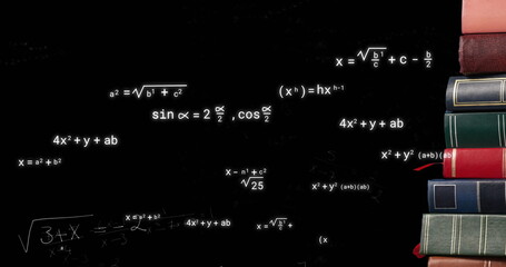 Image of mathematical equations over books on black background