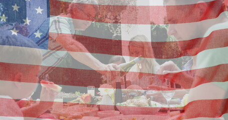 Image of flag of united states of america waving over smiling caucasian family