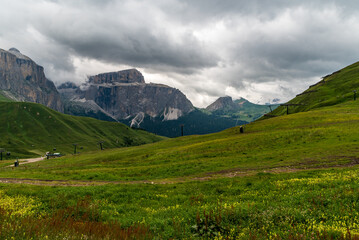 Fototapeta premium Dolomites mountains in Italy - Sella mountain ridge from meadows above Sella pass