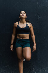 Fototapeta na wymiar young fitness woman on black background
