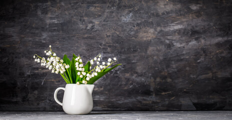 Bouquet spring white Lily of the valley. Floral still life on gr