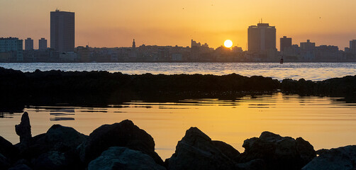 Sunset view of Havana city from across  the harbor from El Morro fortress located in havana - Cuba