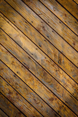 Wooden wall made of diagonal boards with light brown stripes. Background.2