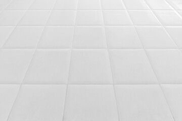 white tile floor in office.White tiles floor for bedroom , kitchen, bathroom and interior design.White tiles floor in perspective view. Clean and symmetrical surface with grid texture background..