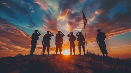 Group of USA Army saluting to US Flag in silhouette sunset