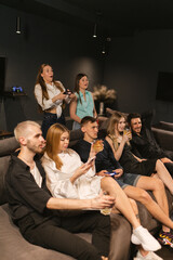 Friends engage in friendly banter soaring competitive spirits. Game room transforms in battleground...