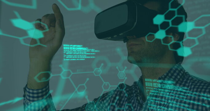 Image of scientific data over caucasian man wearing vr headset in office