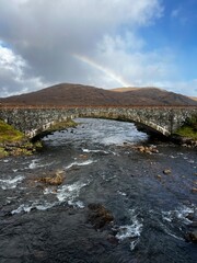 Rainbow over bridge on Isle of Skye, Scotland