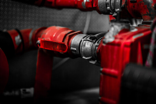 Close up of equipment on board a European fire truck, predominant red color