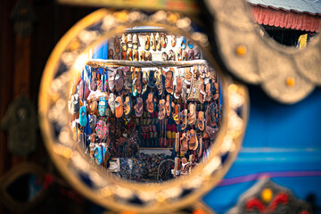 Busy market area in Essaouira, Morocco, with stalls selling various goods