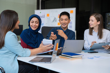 Business team to calculate financial information to invest in new projects. financial manager meeting.euing Smart phone and laptop and digital tablet PCs in office.