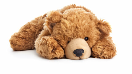 Plush teddy bear lying down on white.