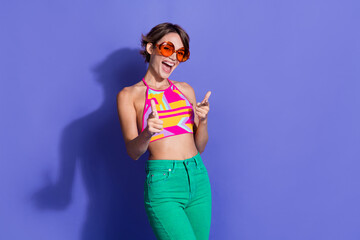 Photo of funky gorgeous lovely woman dressed nice clothes looking camera showing you isolated on purple color background