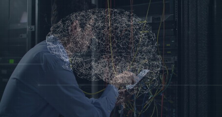 Image of digital brain over asian man in server room