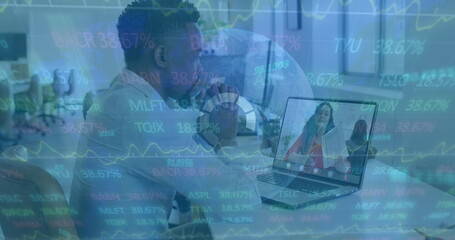 Image of financial graphs, globe and data over african american man having image call on laptop