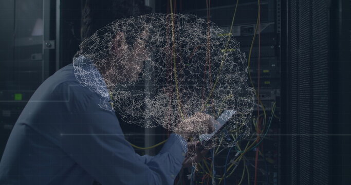 Image of digital brain over asian man in server room