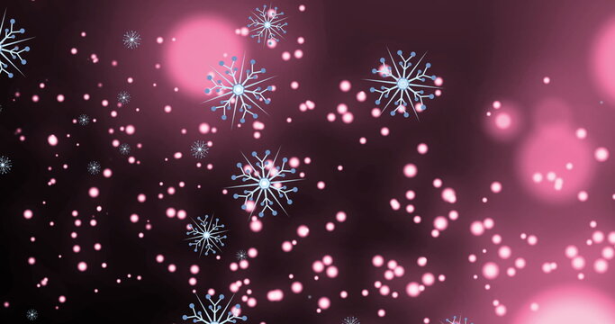 Image of snowflakes over light spots on black background