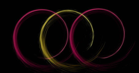 Image of colourful light trails forming circles on black background