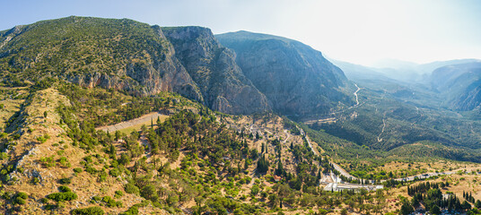 Delphi, Greece. Ruins of the ancient city of Delphi. View of the valley. Sunny weather, Summer morning. 360 degree aerial panoramic asteroid. Aerial view