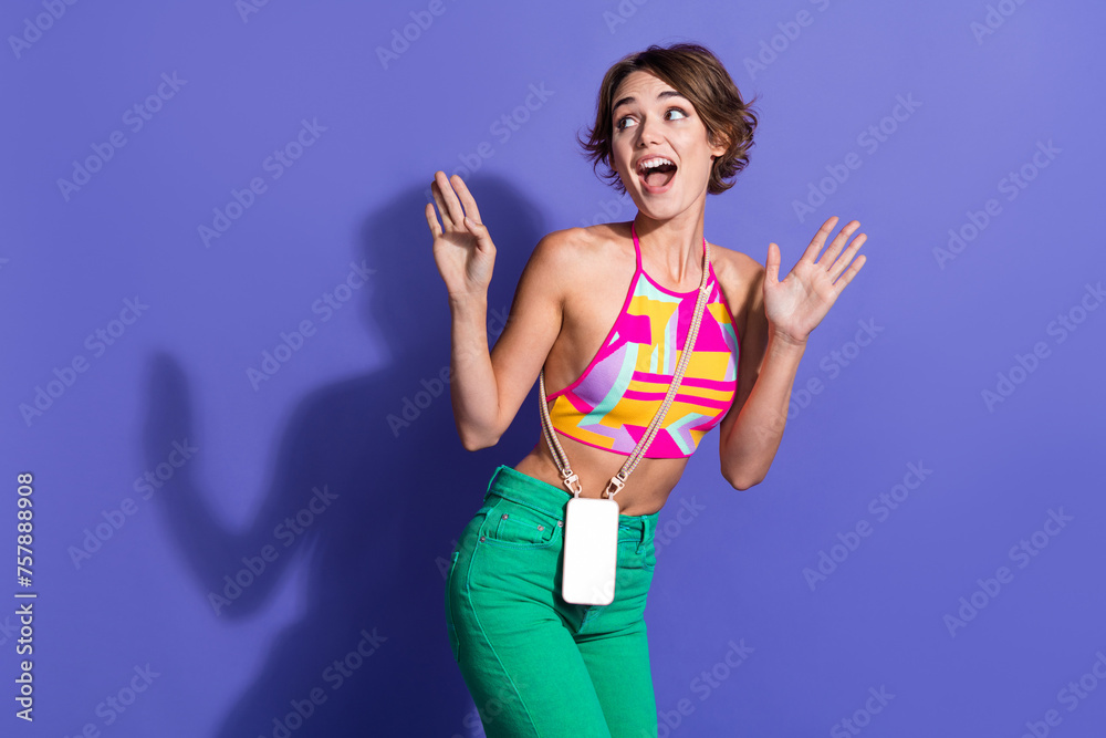 Sticker Photo of hipsters party young girl brown hair wear pink crop top with green pants dancing look novelty isolated on violet color background