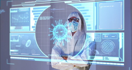 Image of green virus cells over caucasian male lab worker in safety clothes with digital screen
