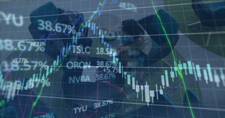 Image of financial data and graphs over diverse coworkers in office