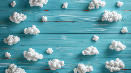 Cute baby card with white clouds on blue wooden background 