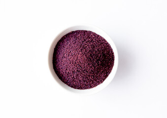 Organic Acai Berry Powder in a White Ceramic Bowl. Top View. Space for Text. Superfood Powder Concept.