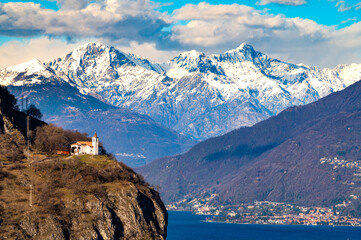 The Church of San Martino, on Lake Como, and the snow-capped mountains in the background.