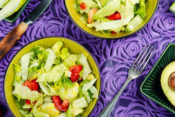 Healthy green salad with fresh vegetables.