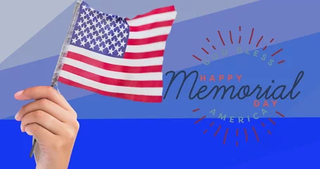 Tuinposter Historisch gebouw Composition of hand holding american flag over happy memorial day text, on blue stripes