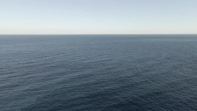 Sweeping View Of A Seascape With Calm Waters. Aerial Wide Shot